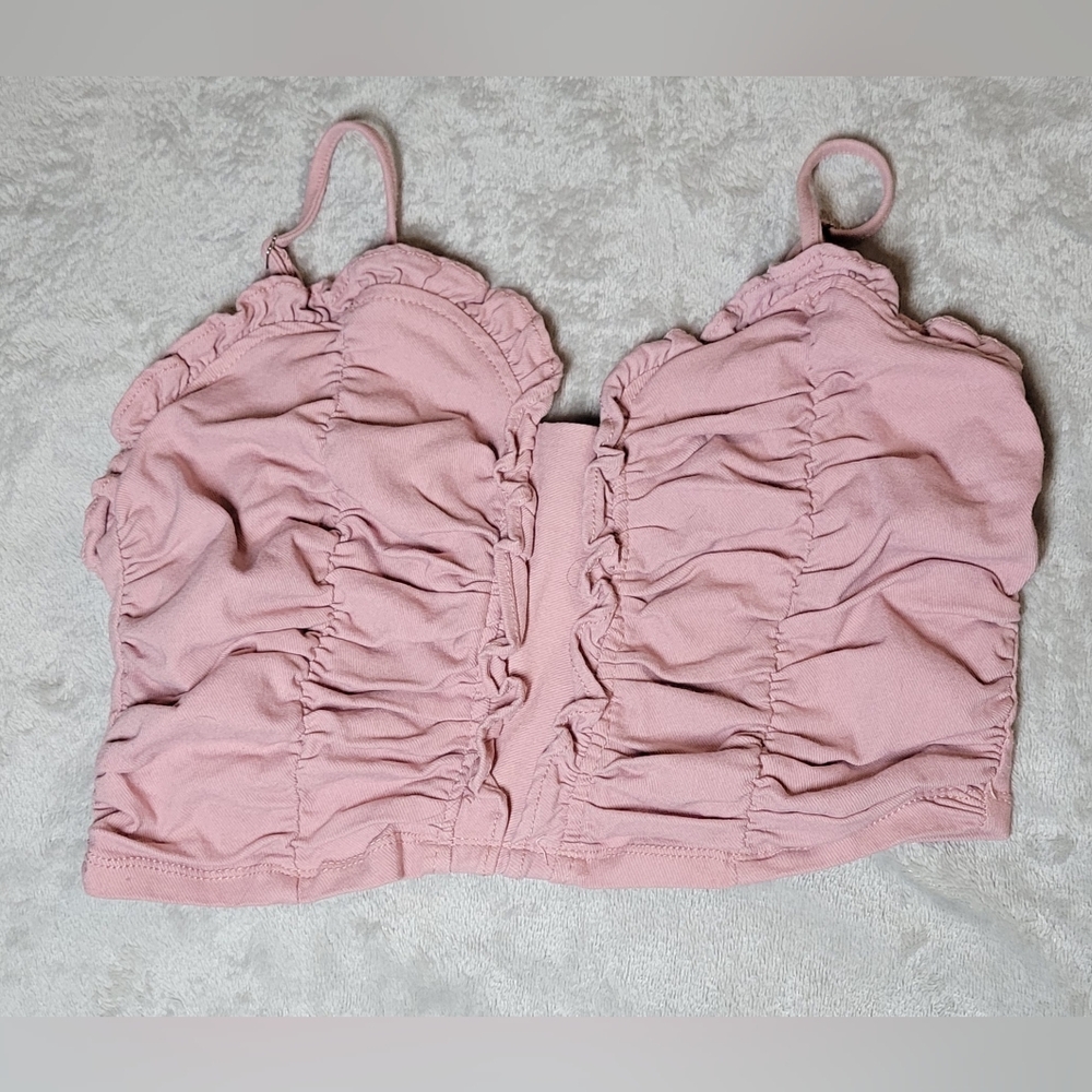 Pink ruffled, crop top. Sized large. Zipper and ruffle detailing.